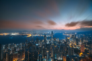 Fototapeta premium Hong Kong city with Victoria Harbor view from peak at dawn 