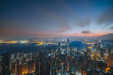 Fototapeta premium Hong Kong city with Victoria Harbor view from peak at dawn 