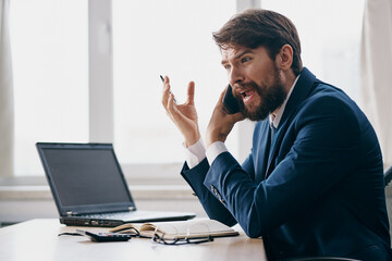 businessmen in the office at the desk career anger technologies