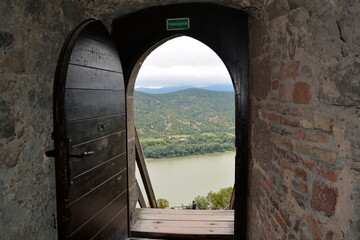 View of the Danube through the doorway of the watchtower of the castle in Visegrad in Hungary Sep 2021