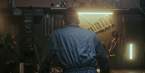 blacksmith, industry, man, face, looking at camera, standing, handmade, handwork, confident, background, turn, success, workbench, portrait, craftsmanship, worker, artisan, ethnic, young, handsome, sm