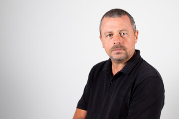 Portrait handsome of serious arms crossed mature man on grey background