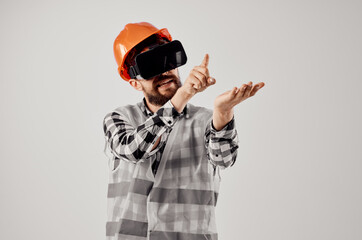 male worker in virtual reality glasses innovation light background