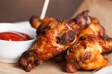 baked chicken wings together with ketchup