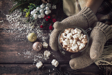 Winter concept. Hot chocolate cacao drink with marshmallows on a wooden table.