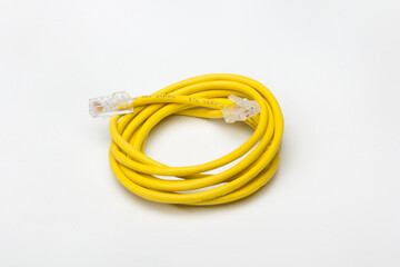 yellow communications cable, coiled to create a circle