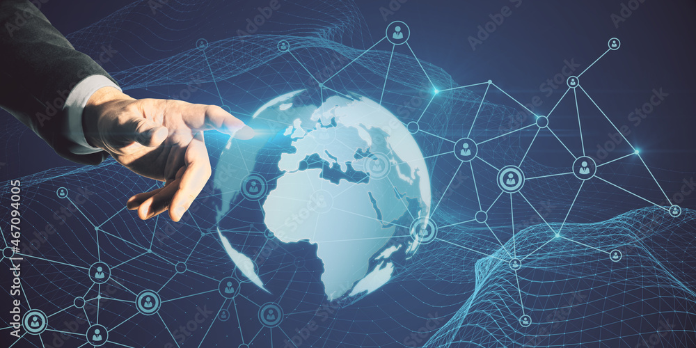 Poster businessman hand pointing at glowing globe hologram with polygonal mesh on blue background. global n