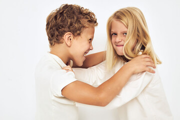 The boy is offended by the little girl smile posing casual wear isolated background