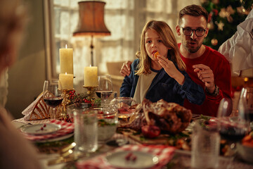 Father and son at the dining table at Christmastime