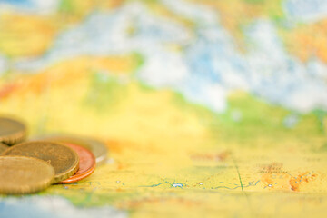 Cash currency of different countries of the world on the map. Trip planning concept