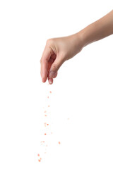 Hand sprinkle pink salt on white background
