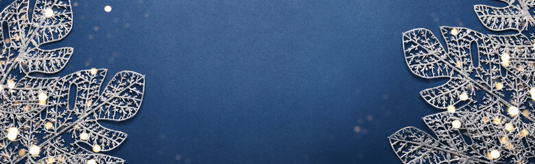 Christmas blue banner. Shining silver pattern made of frost decorative leaves