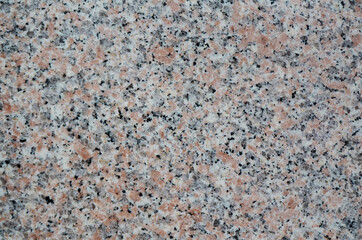 Granite stone texture background. Nature backdrop with a close-up on luxury stone grain pattern.