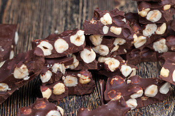milk chocolate with whole and chunks of hazelnuts