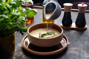 Mushroom cream soup with dumplings. A warming soup.
A tasty dish.Culinary photography. Suggestion to serve the dish.