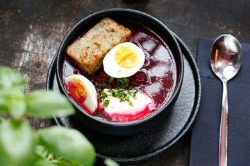 Beet soup with egg.
Appetizing dinner dish. Culinary photography, a proposal to serve a meal.