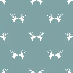 Fototapeten seamless winter pattern with silhouette of deer head with antlers. © Ne Mariya