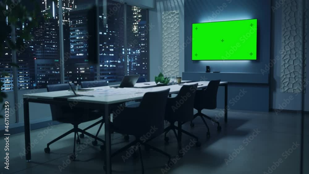 Poster modern empty meeting room with big conference table with various documents and laptop on it. wall tv