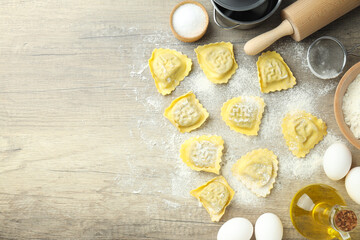 Concept of cooking ravioli on wooden background