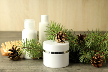 Composition with winter cosmetic products on gray textured table