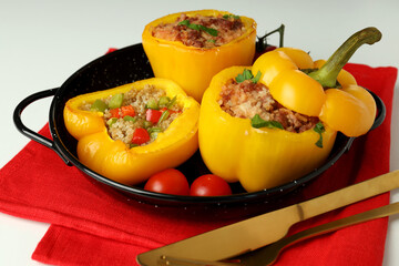 Concept of tasty food with stuffed pepper on white background