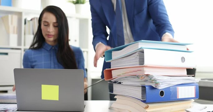 Businessman and businesswoman work with folders of documents and communicate 4k movie