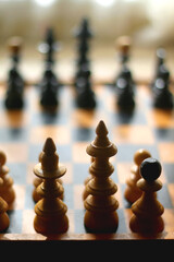 Wooden chessboard and vintage carved figurines. Selective focus.