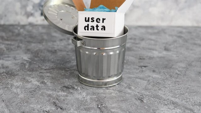 online privacy and stored information, metaphor of box with User data label next to recycle bin