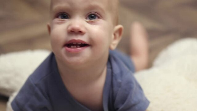 close-up view of blue eyed caucasian baby face with pink eye conjunctivitis. infant child eyes infection, irritation of bacteria or viruses. allergy on infants, viral blepharitis ophthalmology illness