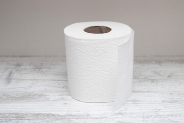 a roll of toilet paper on a white table