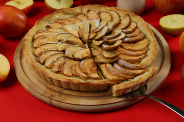 Concept of tasty food with apple pie on red background