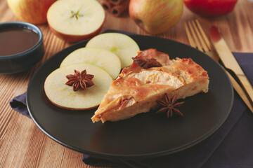 Concept of tasty food with apple pie on wooden background