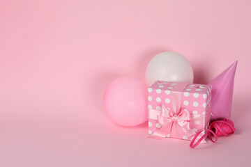 Birthday accessories on pink background, space for text