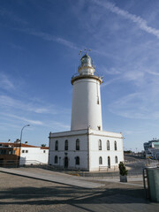 Lighthouse on the side of the harbour at Malaga, Costa del Sol, Spain.