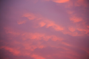 Abstract warm color cloud on blue sky in sunset time background.