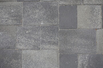 Backdrop - pavement made of rectangular gray concrete blocks