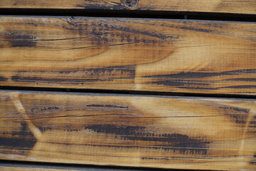 Close view of burnt and brushed wooden planks