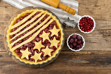 Step 3. Before baking. Homemade cherry pie. Homemade product made from dough with stars. Food for 4th July USA Independence Day. American Pie. Sweet pastries. Berry open round tart.