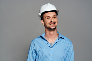 male builder in a blue shirt work emotions isolated background