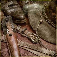 photo ancienne, bottes,chapeau,ceinture et couteau dans étui de cuir - obrazy, fototapety, plakaty