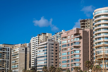 Fototapeta na wymiar Residential buildings seen from a Ramlet al Baida beach on Mediterranean coast in Beirut capital city, Lebanon