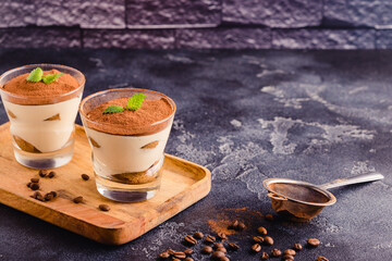 Traditional Italian dessert tiramisu in a glass.