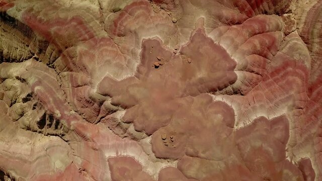 Aerial Top Panning Shot Of Beautiful Patterned Rock Formations In Desert During Sunny Day - Paria River, Colorado