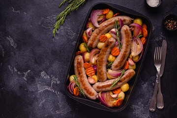 Fried sausages with vegetables.