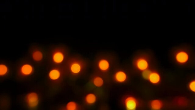 The Orange Bokeh Holiday Decoration Lights On The Dark Black Background