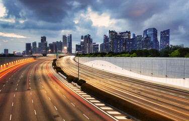 Fototapeta na wymiar Singapore traffic at twilight - financial downtown