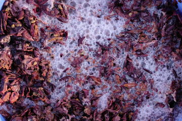 Fermentation of grape must. Winemaking concept. Bubbles and foam. Top view.