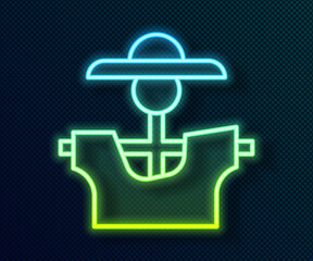 Obraz premium Glowing neon line Scarecrow icon isolated on black background. Vector