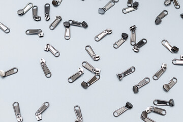 background of sewing fittings on a gray background. top view