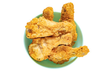 Fried chicken legs in a plate isolated on white background. Classic fast food.